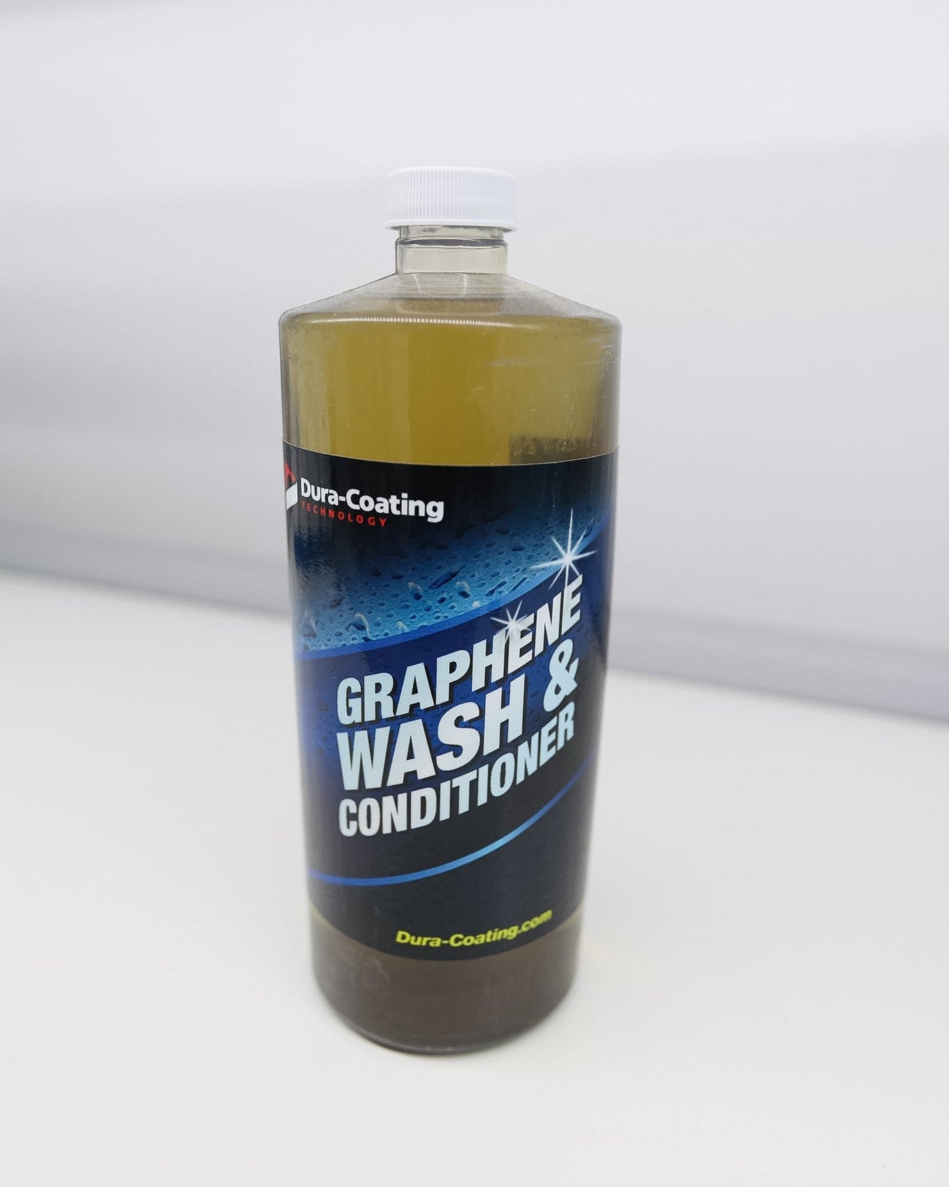 Bottle of graphene wash conditioner on a white background
