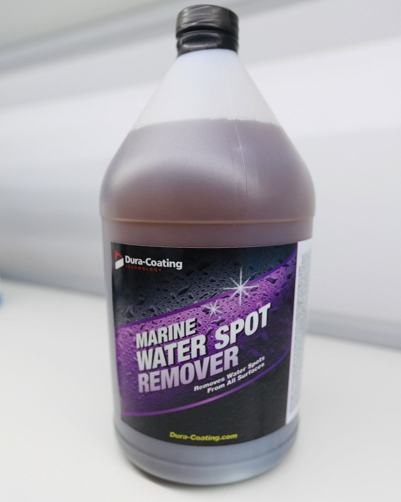 Bottle of marine water spot remover on a white background