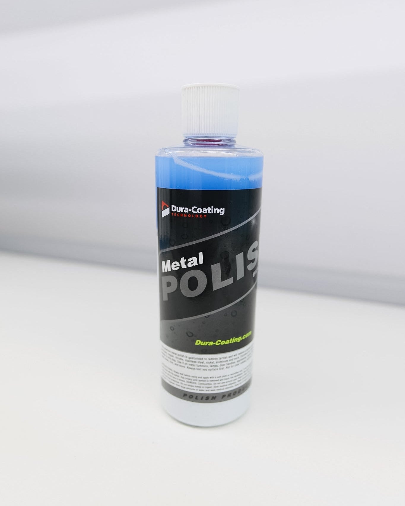 Bottle of Dura-Coating Metal Polish on a white background
